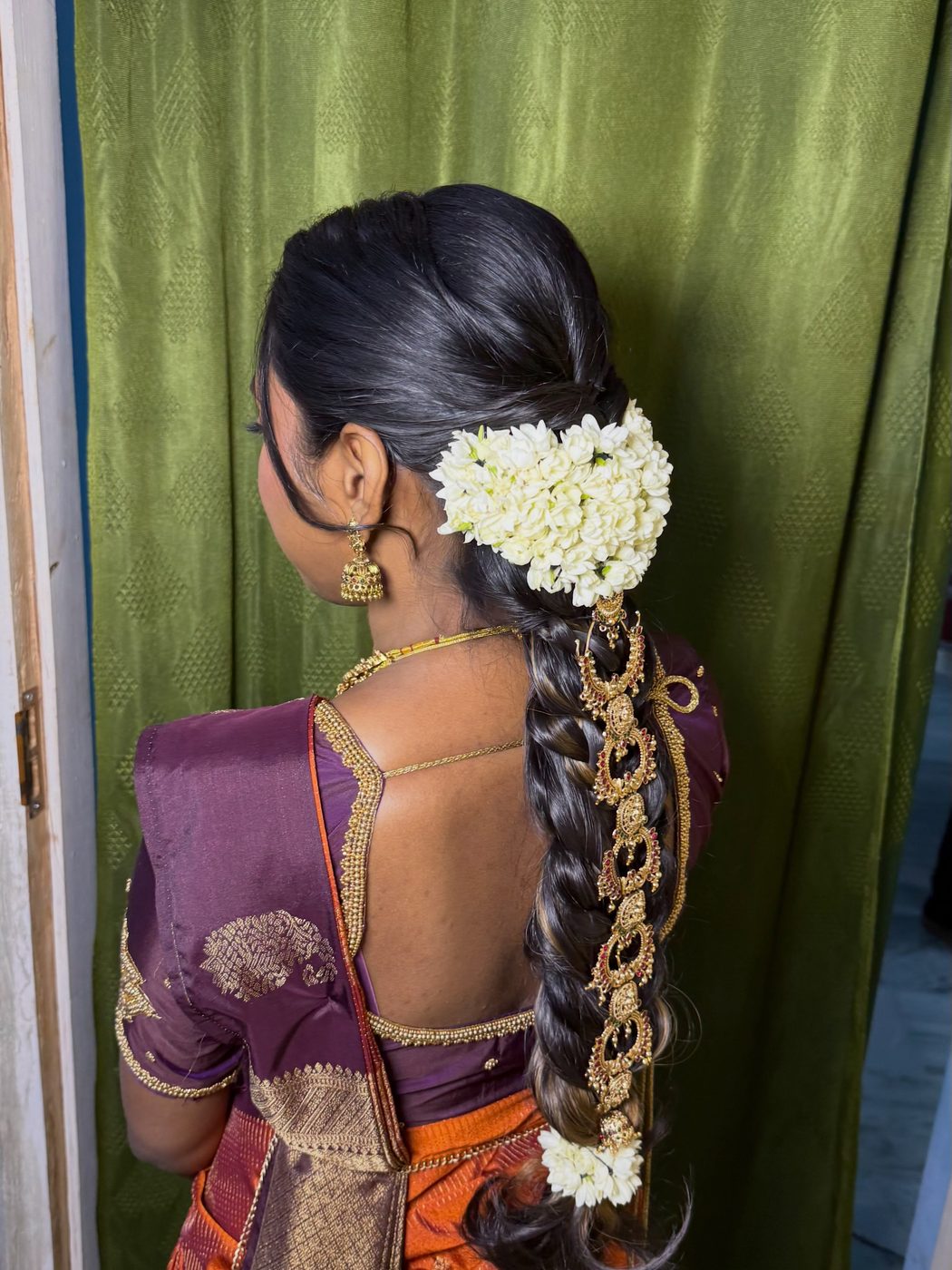 Jasmine braid with a gold hair accessory