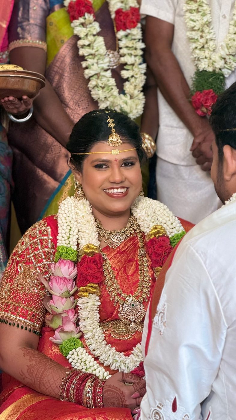Bride at a traditional wedding with flower garlands