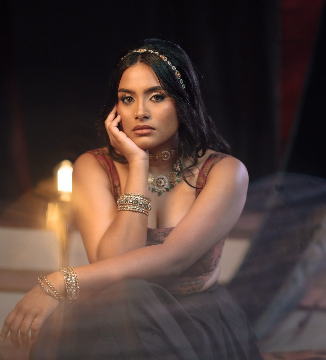 Moody editorial portrait with gold jewellery